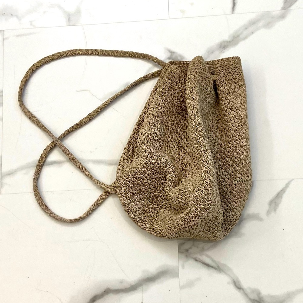 Woven-style backpack. Medium size & tan color. My favorite go-to bag. 11 inches